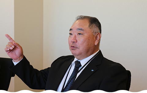 Deputy Director Sato in a conference room at the Institute of Environmental Ecology